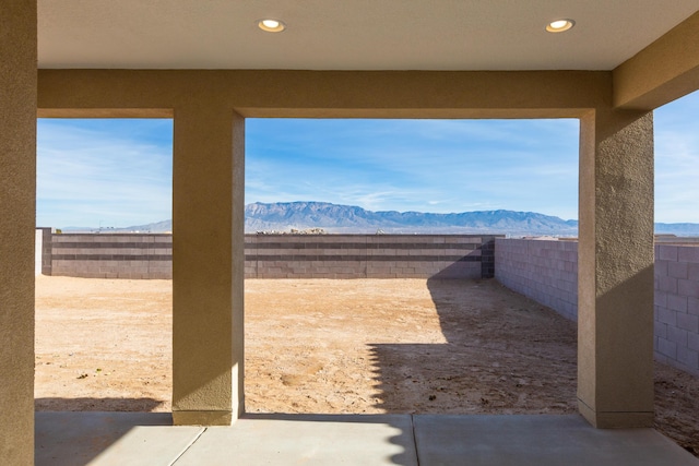 view of patio / terrace with a mountain view