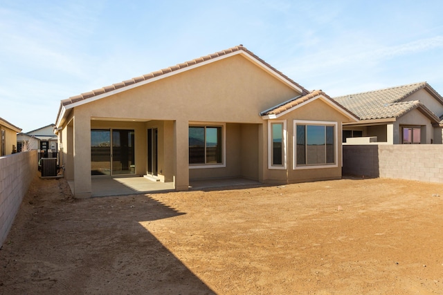 back of property featuring a patio and cooling unit