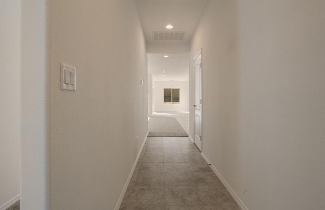 hall with light tile patterned flooring