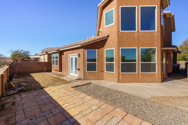 rear view of property featuring a patio