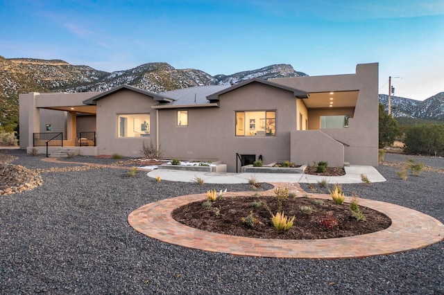 view of front of home with a mountain view