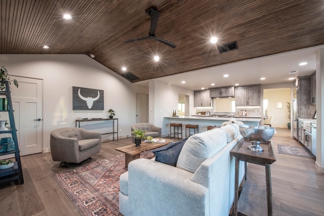 living room with ceiling fan, wood ceiling, lofted ceiling, and light wood-type flooring