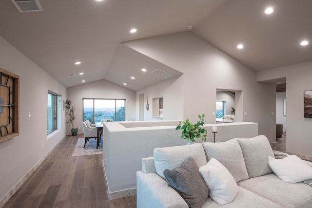 living room with hardwood / wood-style flooring and lofted ceiling