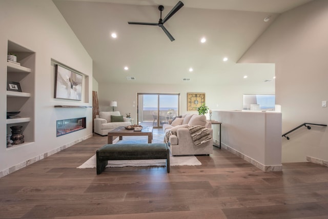 living room featuring ceiling fan, high vaulted ceiling, and dark hardwood / wood-style floors