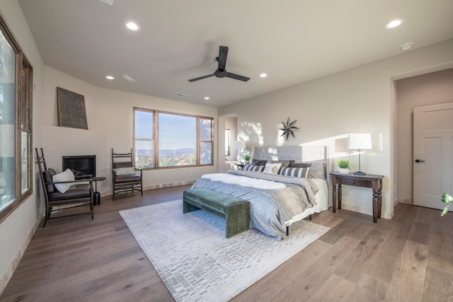 bedroom featuring hardwood / wood-style flooring and ceiling fan