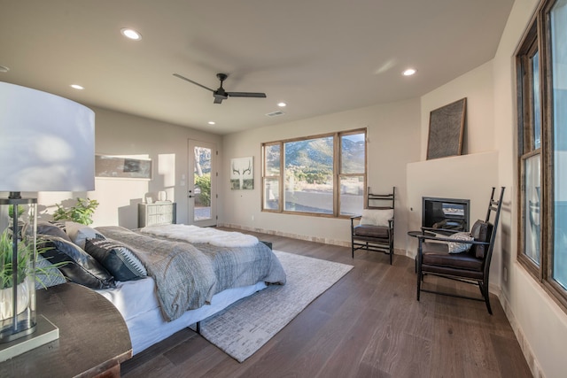 bedroom with ceiling fan and dark hardwood / wood-style flooring