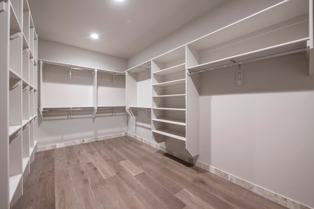 walk in closet featuring hardwood / wood-style flooring