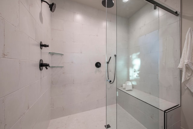 bathroom with a tile shower