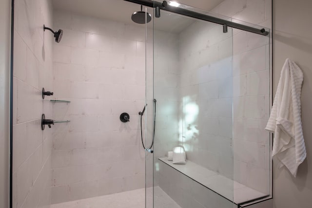 bathroom with a shower with shower door