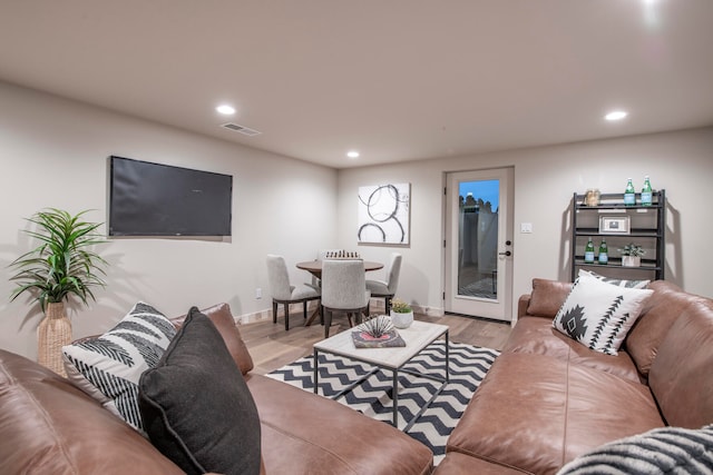 living room with light hardwood / wood-style flooring