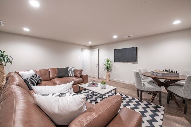 living room with light hardwood / wood-style flooring