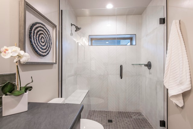 bathroom with vanity, an enclosed shower, and toilet