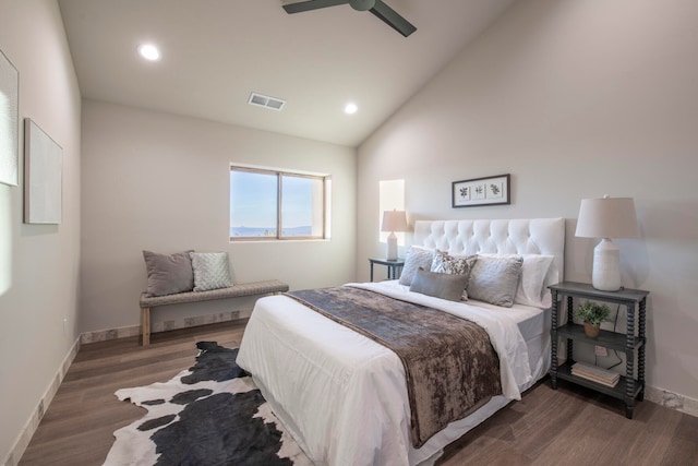 bedroom with ceiling fan, dark hardwood / wood-style flooring, and high vaulted ceiling