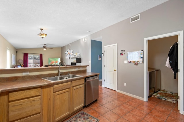 kitchen featuring ceiling fan, sink, tile patterned flooring, stainless steel dishwasher, and lofted ceiling