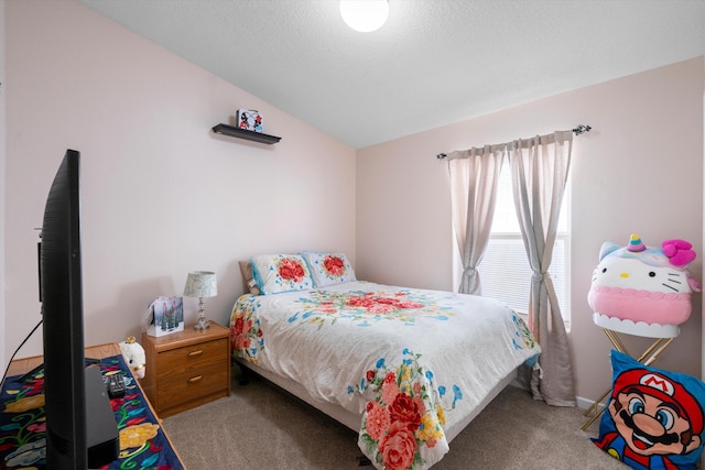 bedroom featuring a textured ceiling, lofted ceiling, and light carpet