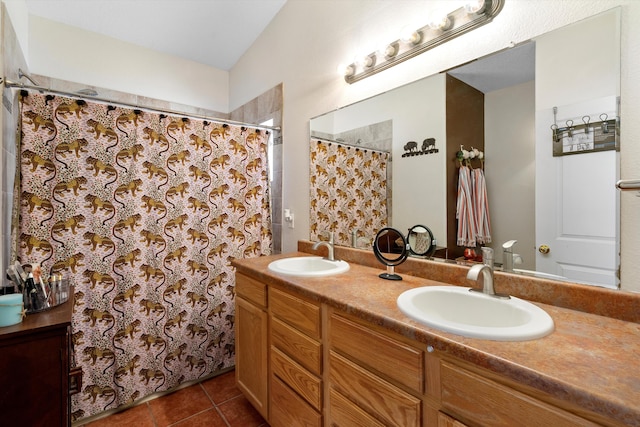 bathroom with tile patterned flooring and vanity