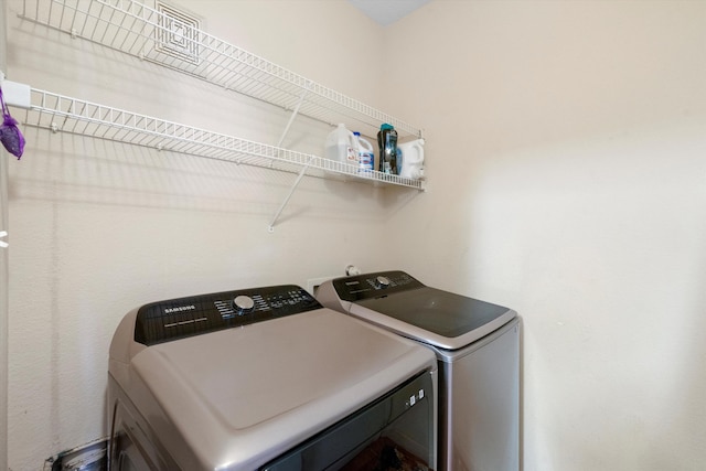 washroom featuring separate washer and dryer