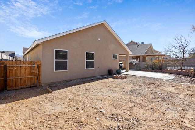 rear view of house with a patio