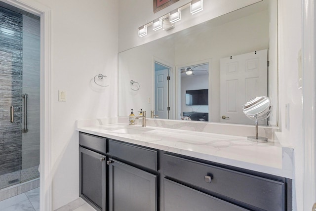 bathroom with vanity and an enclosed shower