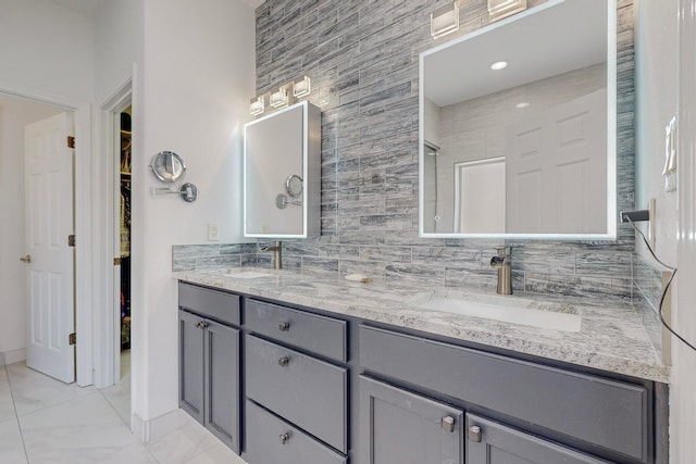 bathroom featuring vanity and tile walls