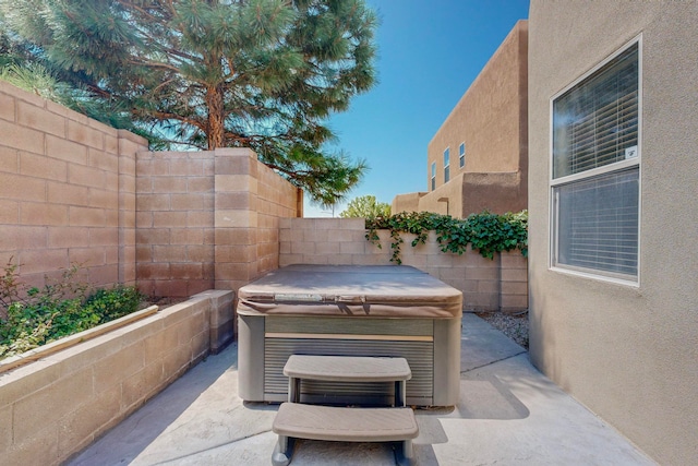 view of patio with a hot tub