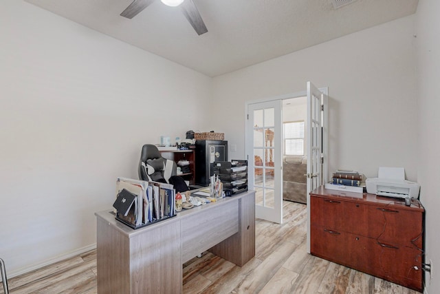 office area featuring french doors, light hardwood / wood-style flooring, and ceiling fan