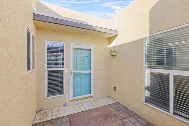 property entrance with a patio