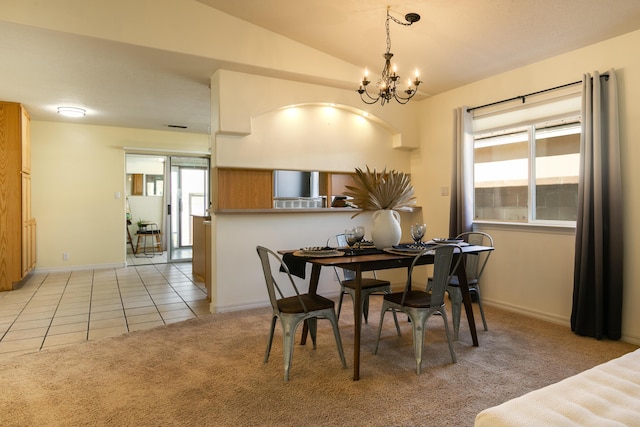 dining area with light tile patterned floors, a chandelier, lofted ceiling, light carpet, and baseboards