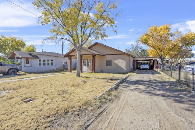 single story home featuring a carport