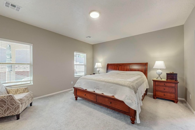 bedroom with light colored carpet