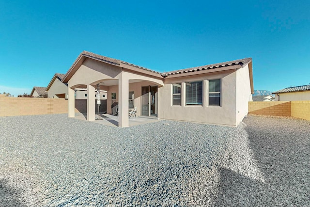 rear view of property with a patio area