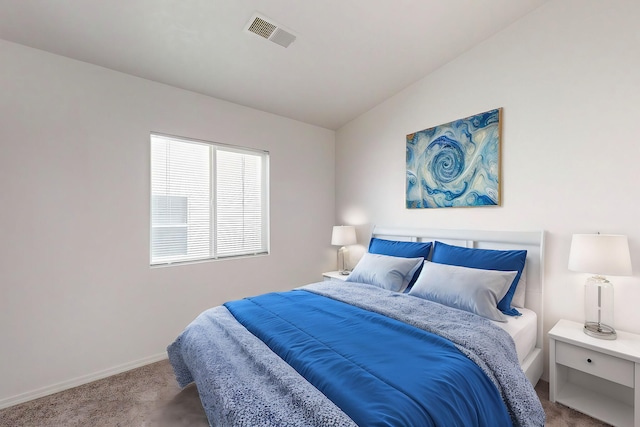 bedroom featuring carpet flooring and lofted ceiling