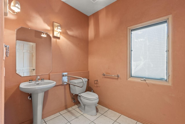 bathroom with tile patterned floors, sink, and toilet