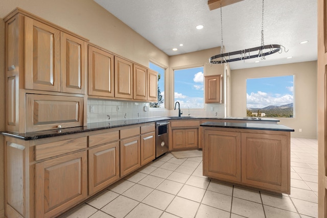 kitchen featuring sink, stainless steel dishwasher, a textured ceiling, decorative backsplash, and light tile patterned flooring