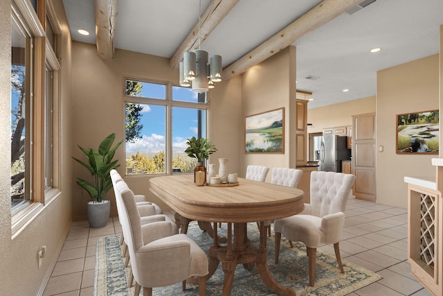 tiled dining area with beam ceiling and a chandelier