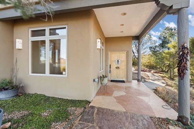 doorway to property featuring a patio area