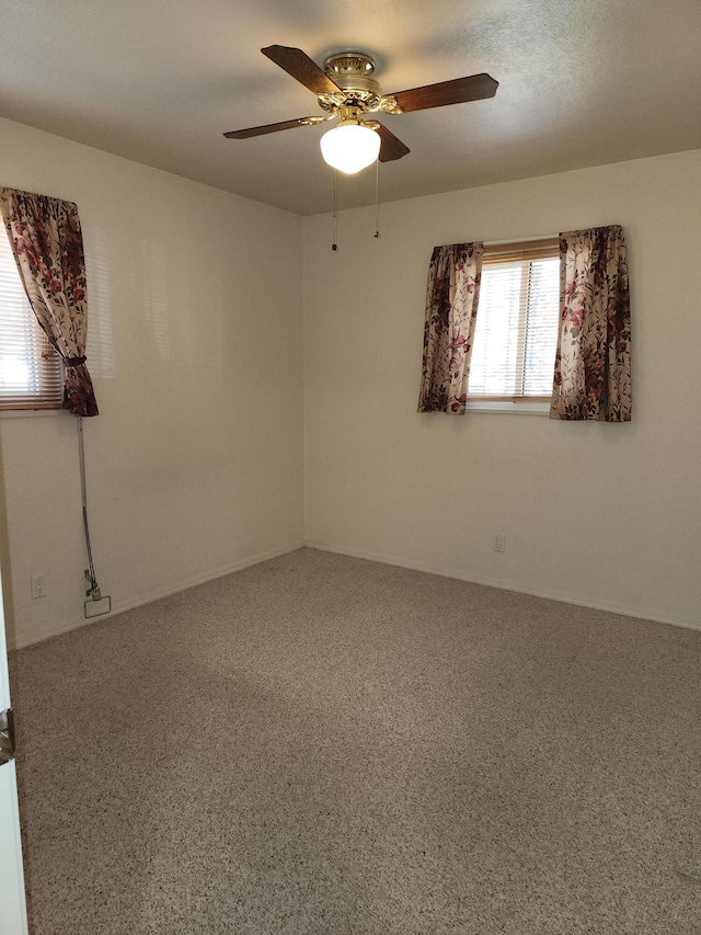 unfurnished room with ceiling fan