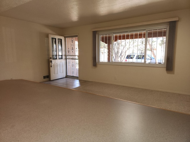 interior space featuring a textured ceiling