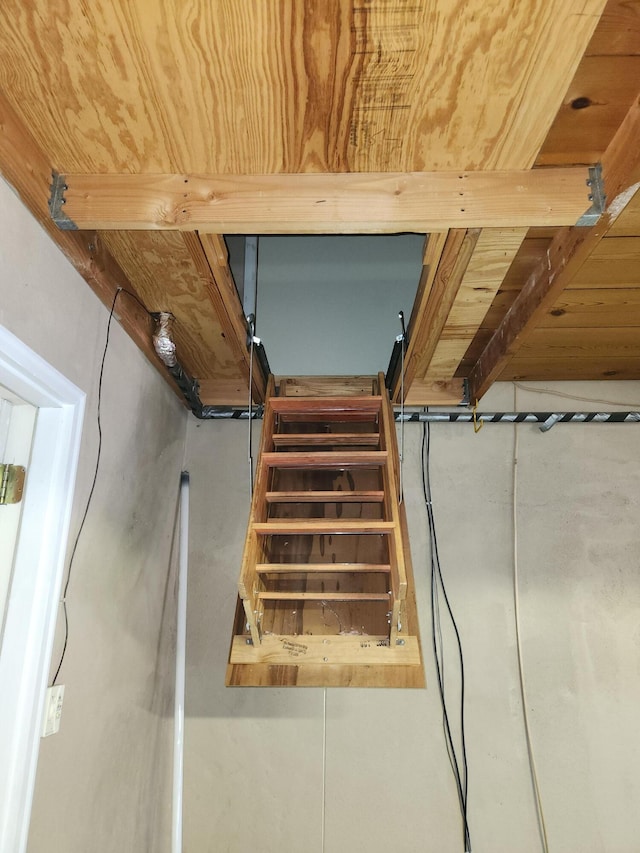 staircase featuring wooden ceiling