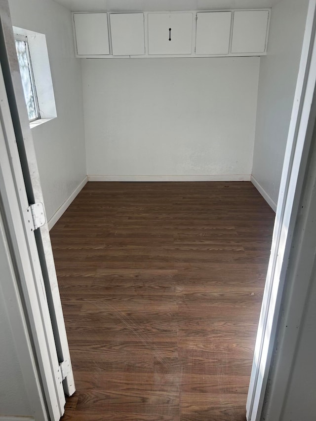 interior space with dark hardwood / wood-style floors