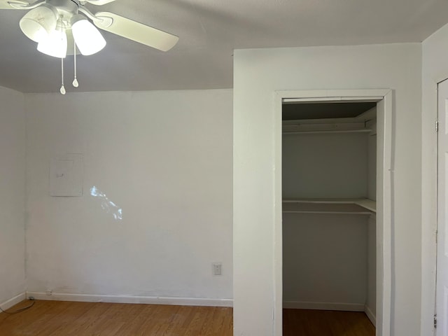 unfurnished bedroom featuring a closet, ceiling fan, and hardwood / wood-style floors