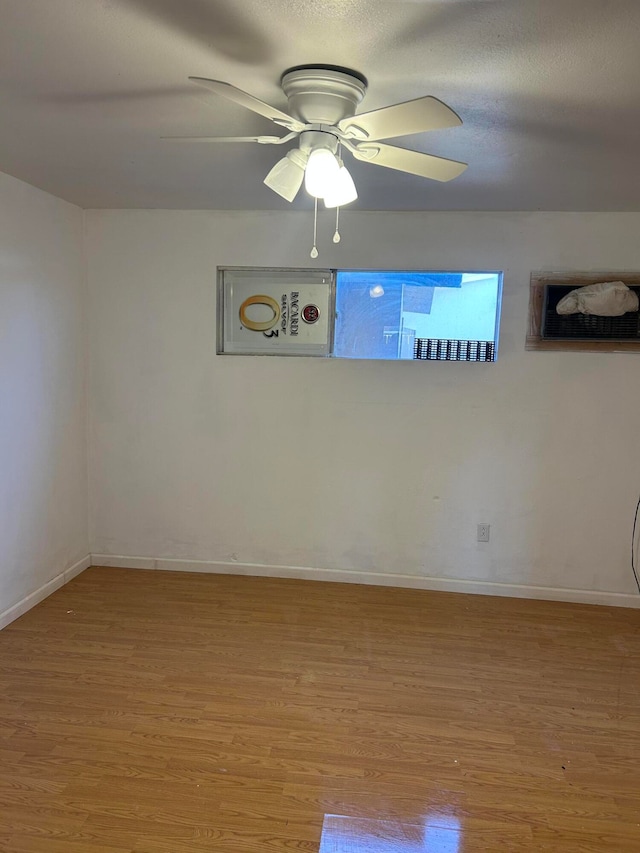 unfurnished room featuring wood-type flooring and ceiling fan