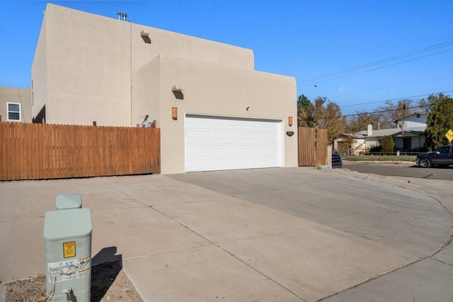 view of side of home with a garage