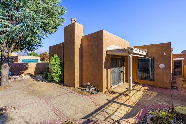 back of property featuring a patio area