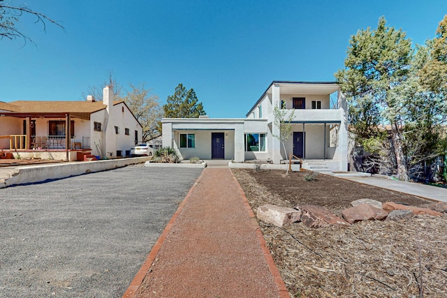 view of front of home featuring a balcony