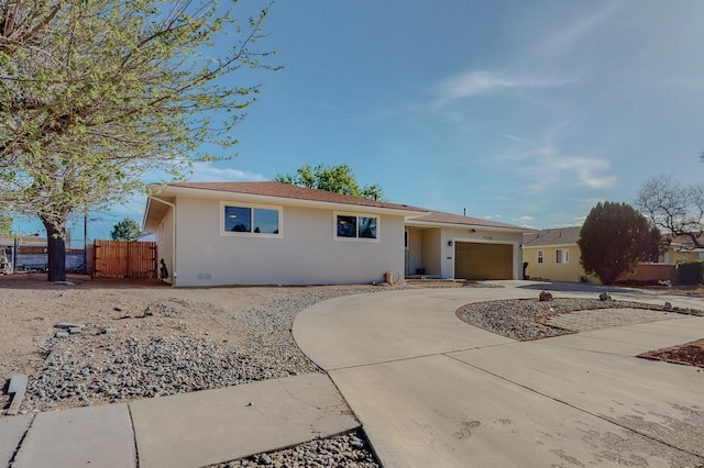 ranch-style home featuring a garage