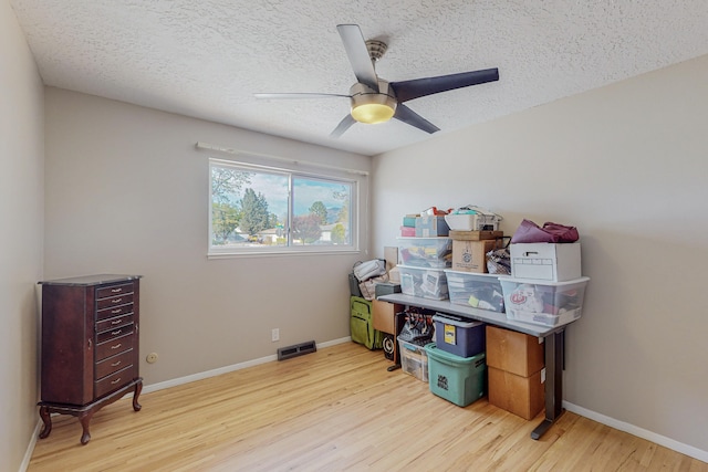 storage area with ceiling fan