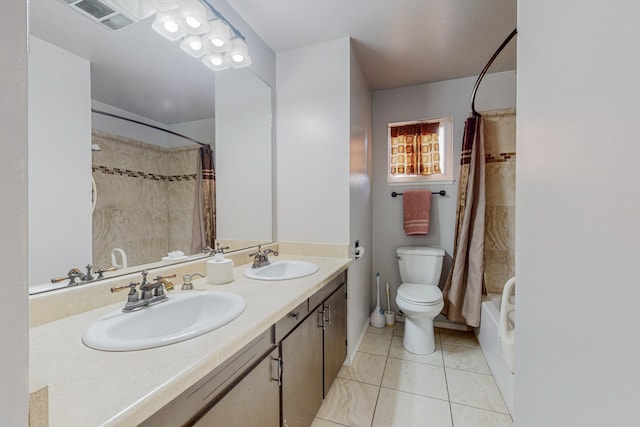 full bathroom with tile patterned floors, toilet, vanity, and shower / bath combo