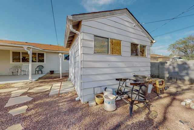 view of side of home with a patio area