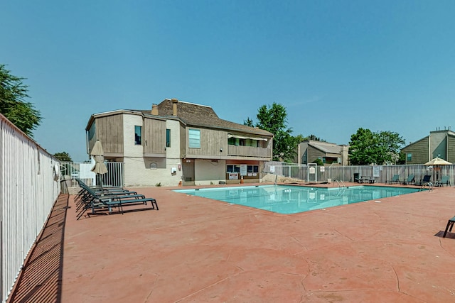 view of swimming pool with a patio